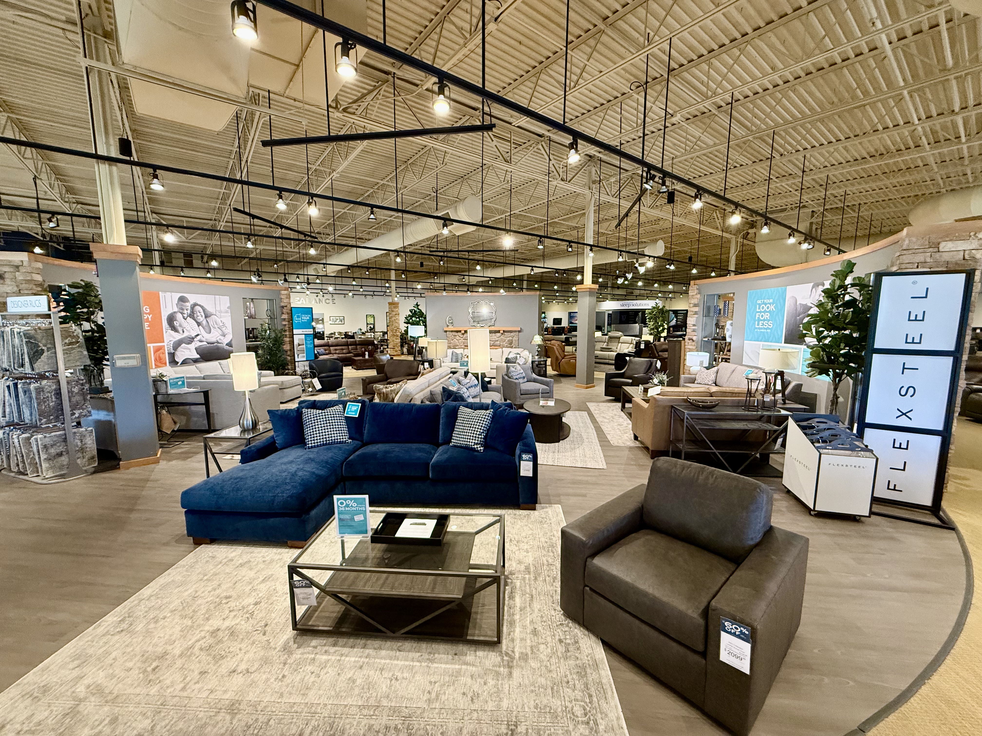 Interior designer arranging furniture and material selections for a custom room